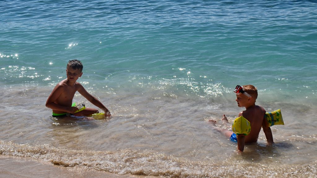 Kids swimming at Lombok safe beach