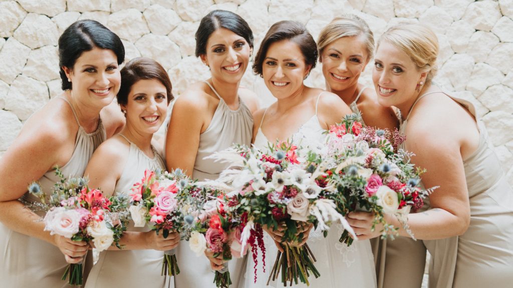 pink and white wedding bouquets with roses, tulips and lily of the incas