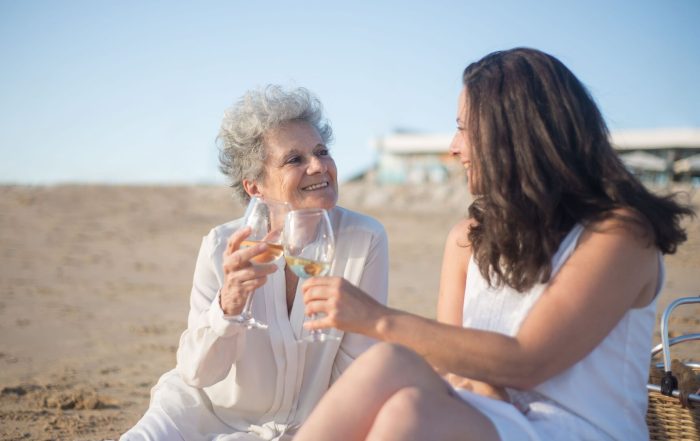 Elderly woman and young family member bonding on holiday.
