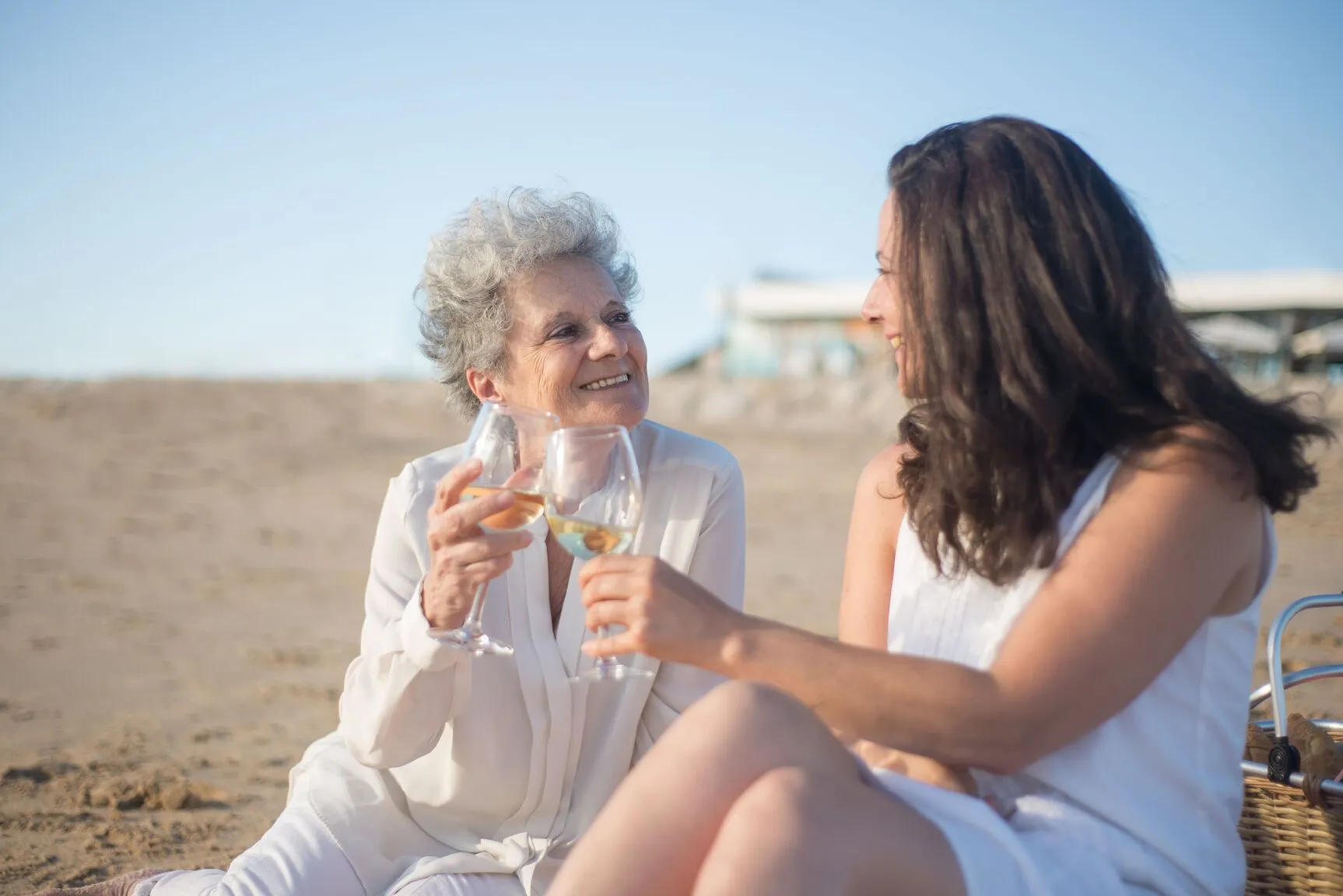 Elderly woman and young family member bonding on holiday.
