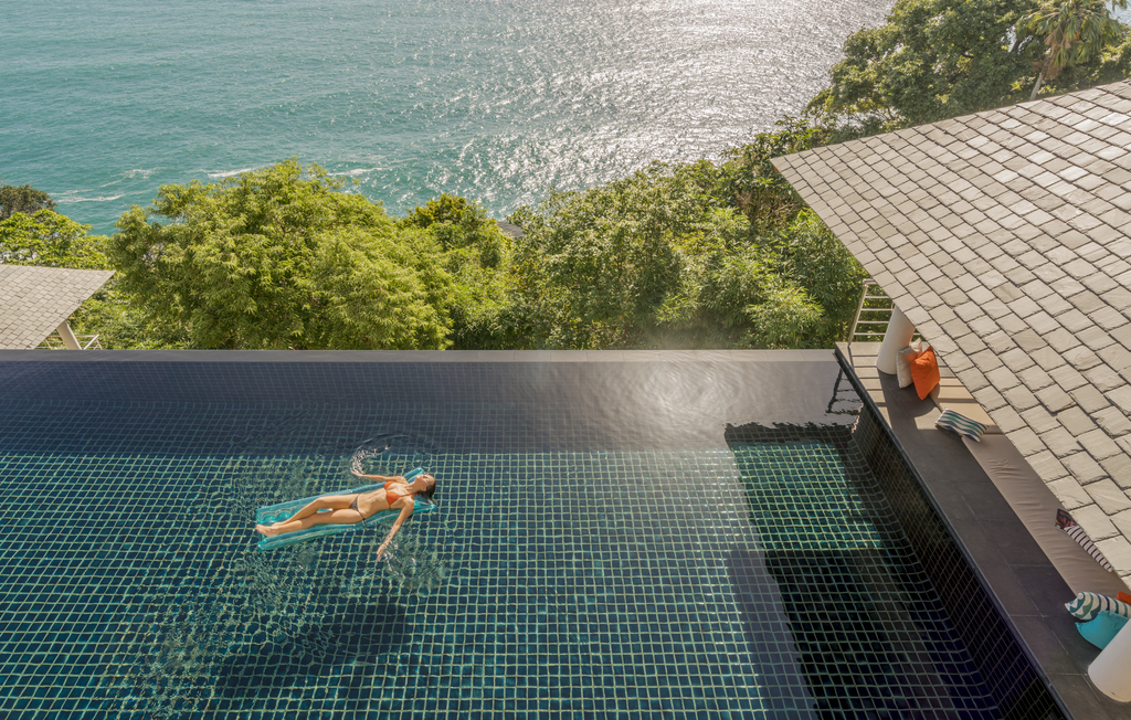 Traveler swimming at Villa Baan Paa Talee