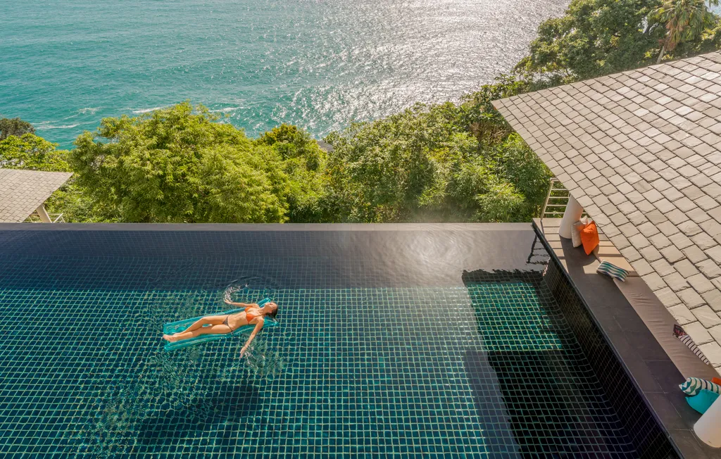 Traveler swimming at Villa Baan Paa Talee