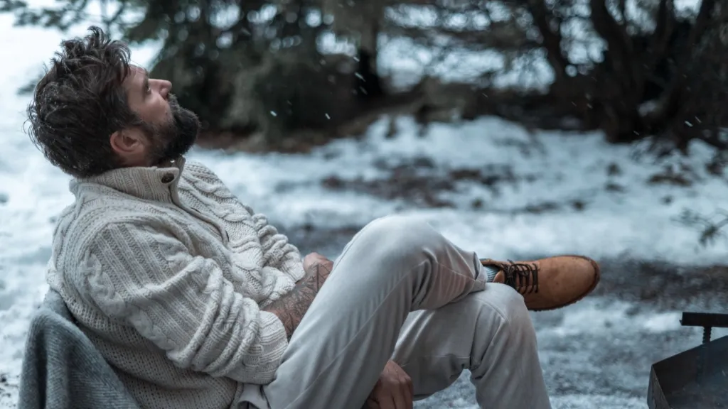 Man sitting outdoors on a snowy day