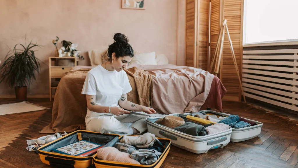 Woman packing winter clothes