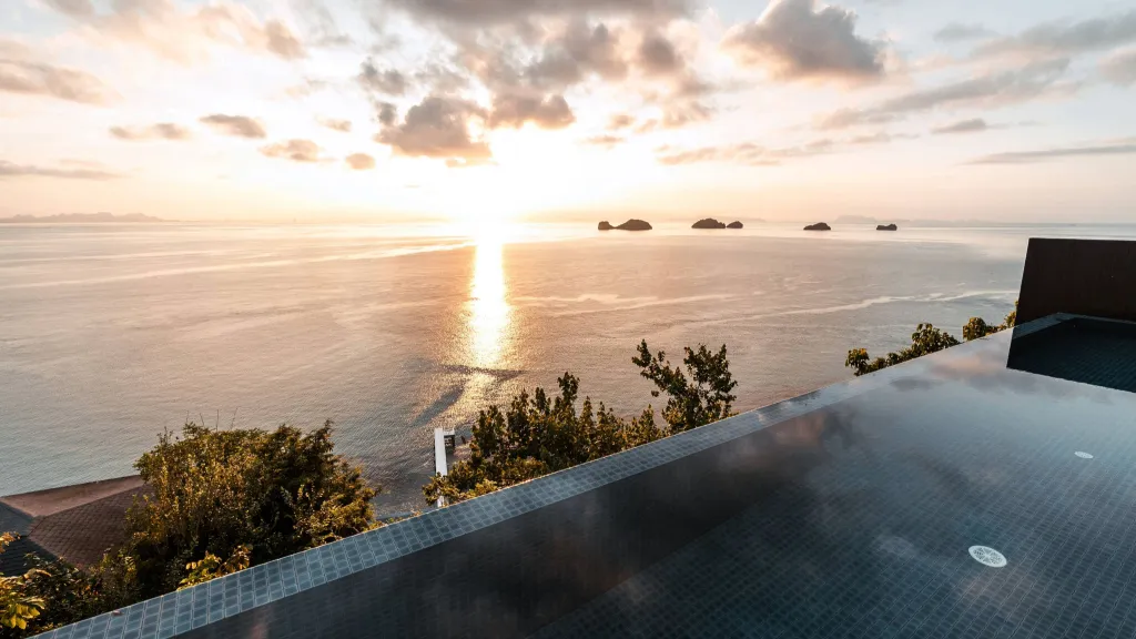 Beautiful sunset view over an infinity pool in Koh Samui, Thailand